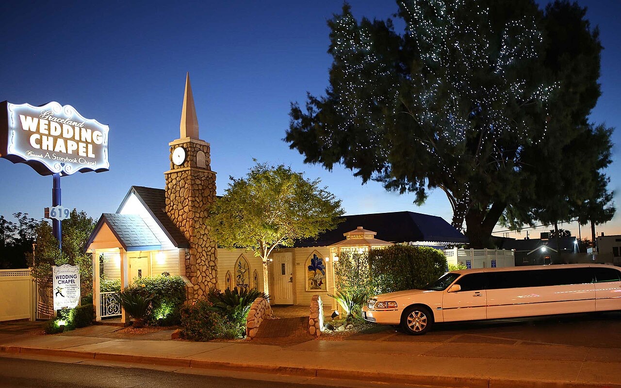 Graceland Wedding Chapel in Downtown Las Vegas at dusk with its sign lit